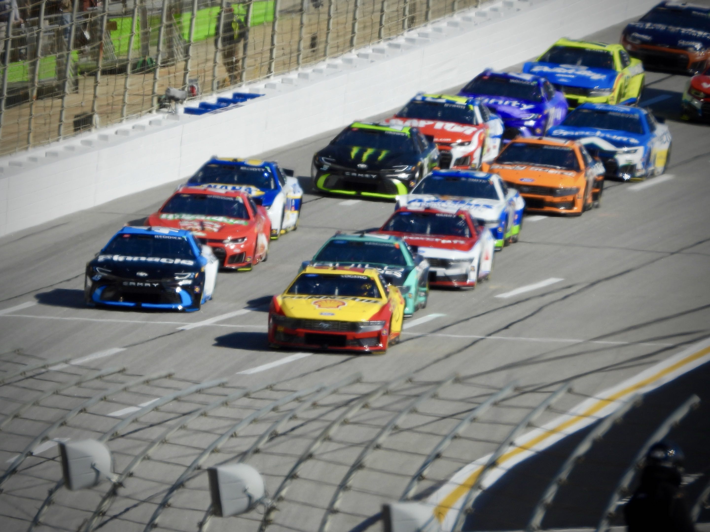 The NASCAR Cup Series pack racing through turn 4 at EchoPark Speedway in Atlanta